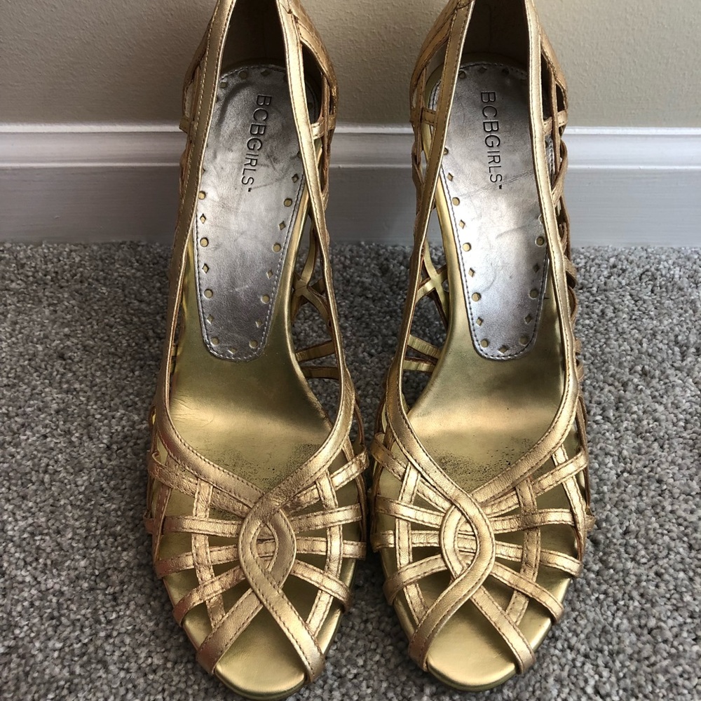 Used gold metallic open toe heels.